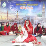 A girl Naat Khawan is reciting a Naat during Mehfil-e-Milad at Latifabad