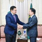 Federal Minister for Economic Affairs Ahad Cheema is shaking hand with Masatsugu Asakawa President of Asian Development Bank in Federal Capital