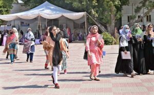 Students leaving Sargodha University after participating in the medical entrance test (MCAT).