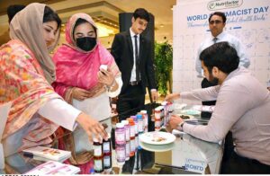Female visitors show interest in a pharmaceutical stall during World Pharmacists Day, organized by the Young Pharmacists Community Pakistan.