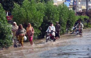 Vehicles passing through stagnant rain water accumulated at Jail Road.