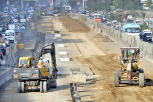 A view of the development work of Red Line is underway with the help of heavy machinery at University Road in the Provincial Capital.