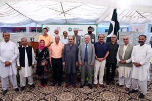Federal Secretary for Education and Professional Training Mohyuddin Ahmad Wani in a group photograph with participants during Inauguration ceremony "Green Learning Farm" by knowledge Platform at Islamabad Model School E-7.