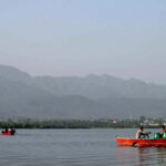 A beautiful day for boating at Rawal Lake as people enjoy the serene waters in the Federal Capital