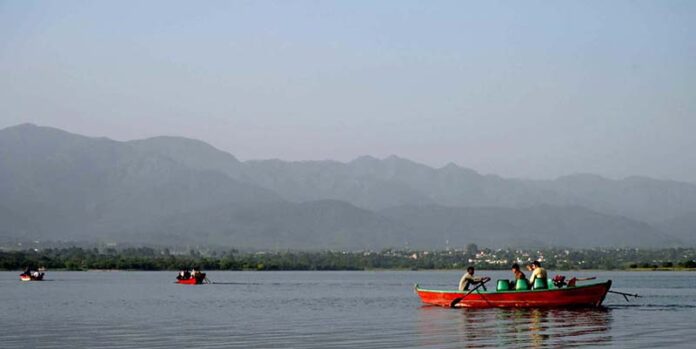 A beautiful day for boating at Rawal Lake as people enjoy the serene waters in the Federal Capital