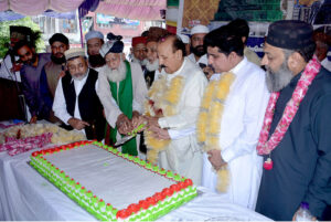 MPA Tahir Jameel with Markzi Milad Committee cutting cake to celebrate birthday of Holy Prophet Muhammad (Peace Be Upon Him) at Clock Tower Chowk