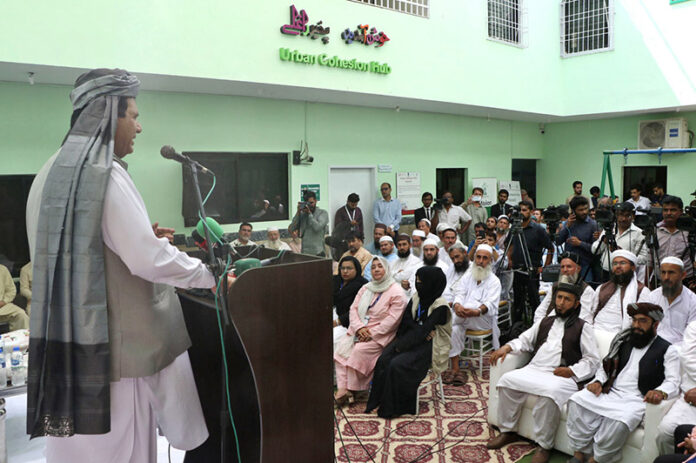 Federal Minister for States, Frontier Regions and Kashmir Affairs and Gilgit Baltistan, Engineer Ameer Maqam, addressing to elders of Afghan Refugees during visit of Urban Cohesion Hub Karachi