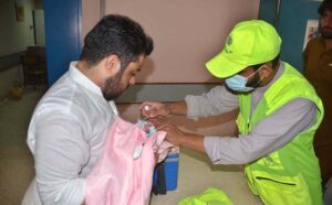 A health worker administers polio drops to a new bron babyat GHQ Hospital Quetta, as part of the Polio-Free Pakistan drive in provincial capital.