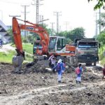 Heavy machinery being used for the repair of Pandora Link Road in the Federal Capital