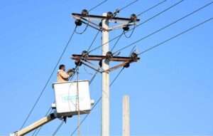A WAPDA employee is busy repairing electric pole wires on Commissioner's Office Road to ensure smooth power supply in the city.