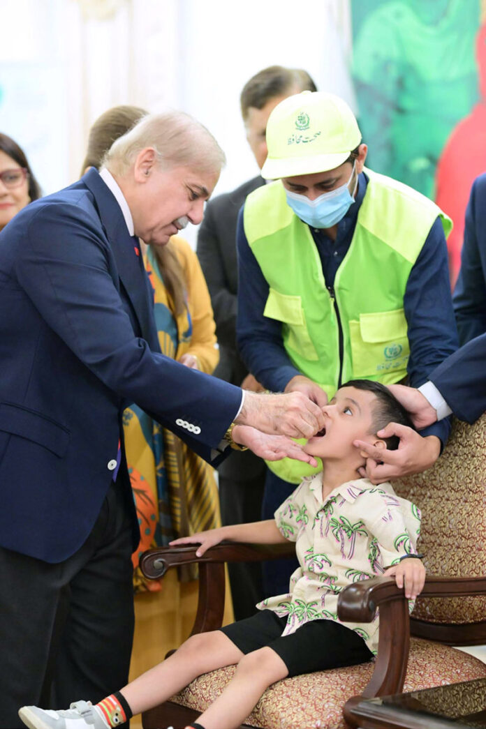 Prime Minister Muhammad Shehbaz Sharif administering polio vaccination to children to kicks tart countrywide Special Anti-Polio Campaign