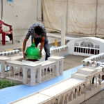 A vendor preparing Masjid Model in connection with Eid Milad-un-Nabi (PBUH)