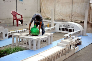 A vendor preparing Masjid Model in connection with Eid Milad-un-Nabi (PBUH)