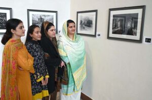 Art lovers inspect the exhibition with interest during the opening ceremony of Muhammad Azaz Hafeez's photo exhibition and book launch of 'Black and White Grey' at PNCA.