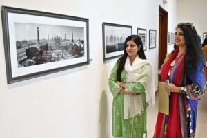 Art lovers inspect the exhibition with interest during the opening ceremony of Muhammad Azaz Hafeez's photo exhibition and book launch of 'Black and White Grey' at PNCA.