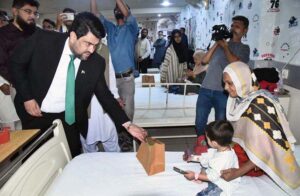Governor Sindh Kamran Khan Mustafa presents gifts to cleft-operated children at Al-Mustafa Medical Center in Provincial Capital.