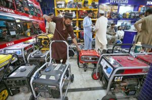 Vendor selling and displaying power generators to attract the customers at Sadar Bazaar.