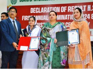 Secretary Education Board Zahoor Ahmed Chauhan and Controller of Examinations Asma Qasim giving certificates of appreciation to the best performing students and teachers during the grand function of the Intermediate Annual Examinations 2024.