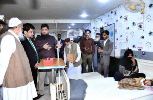 Governor Sindh Kamran Khan Mustafa presents gifts to cleft-operated children at Al-Mustafa Medical Center in Provincial Capital.