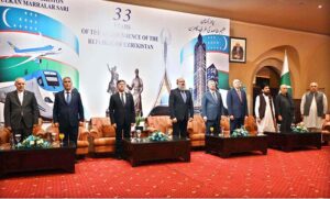 Federal Minister for Commerce Jam Kamal Khan, along with Oybek Usmanov, Ambassador of Uzbekistan to Pakistan standing in respect during the national anthems of both countries during a ceremony celebrating the 33rd Anniversary of the Independence Day of the Republic of Uzbekistan