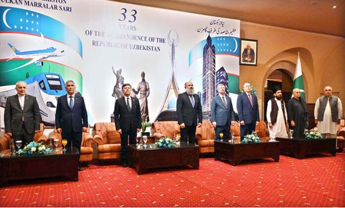 Federal Minister for Commerce Jam Kamal Khan, along with Oybek Usmanov, Ambassador of Uzbekistan to Pakistan standing in respect during the national anthems of both countries during a ceremony celebrating the 33rd Anniversary of the Independence Day of the Republic of Uzbekistan