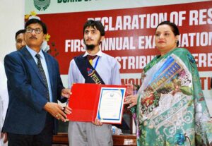 Secretary Education Board Zahoor Ahmed Chauhan and Controller of Examinations Asma Qasim giving certificates of appreciation to the best performing students and teachers during the grand function of the Intermediate Annual Examinations 2024.