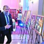 Federal Minister for Commerce Jam Kamal Khan along with Oybek Usmanov, Ambassador of Uzbekistan to Pakistan viewing photos during a ceremony celebrating the 33rd Anniversary of the Independence Day of the Republic of Uzbekistan