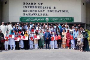 Secretary Education Board Zahoor Ahmed Chauhan and Controller of Examinations Asma Qasim giving certificates of appreciation to the best performing students and teachers during the grand function of the Intermediate Annual Examinations 2024.