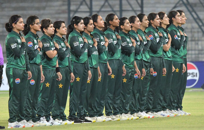Players of Pakistan Women's cricket team stand in respect during the National Anthem before the 1st T20 match against South Africa Women at Multan Cricket Stadium