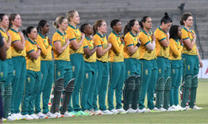 Players of Pakistan Women's cricket team stand in respect during the National Anthem before the 1st T20 match against South Africa Women at Multan Cricket Stadium