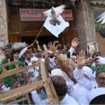 Pir Syed Inayat Ali Shah & devotees release pigeons on the occasion of Eid Milad-un-Nabi (SAWW) celebrations outside at Milad house
