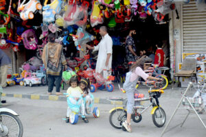 Children test-riding bicycles while selecting the best ones to purchase near the Blue Dome stop