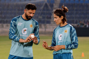 Pakistan Women cricket team bowling coach Junaid Khan giving tips to the Pakistan women team bowler Diana Baig during net practice session for the upcoming three T20 series against South Africa Women cricket team at Multan Cricket Stadium