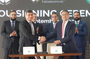 Project Director DHA Multan, Brigadier Ahmed Rizwan Ghumman during MoU signing ceremony with CEO Hashoo Group Shakir Bhura for joint development projects.