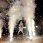 Participants light fireworks during the Mashal Bardar Jaloos (torch march) to celebrate Eid-e-Milad-un-Nabi