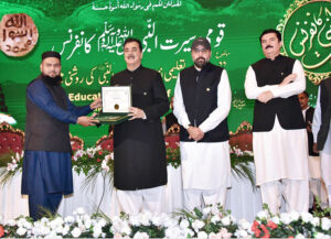 Chairman Senate, Syed Yousuf Raza Gilani handing over awards to winners of the competition in different categories at "Seerat-un-Nabi conference"