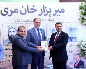 Federal Minister for Planning Ahsan Iqbal with writer Ammar Masood and Researcher Khalid Fareed on the occasion of launching of book "Mir Hazar Khan Marri: Muzahimat se Mufahimat Tak" by Sang-e-meel Publications