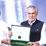 Deputy Prime Minister and Foreign Minister Ishaq Dar and Minister for Religious affairs and inter-faith Harmony Chaudhary Salik Hussain distributing certificates and shields among winners of Naat and Qirat competition