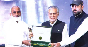 Deputy Prime Minister and Foreign Minister Ishaq Dar and Minister for Religious affairs and inter-faith Harmony Chaudhary Salik Hussain distributing certificates and shields among winners of Naat and Qirat competition