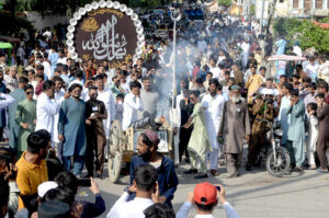 A large number of people participating in a procession of Eid-e-Milad-un-Nabi (SAWW) celebrations at Tilak Incline