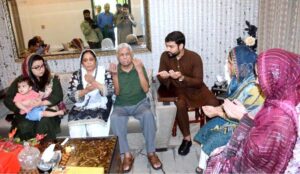 Minister of State for IT and Telecommunication Ms. Shaza Fatima Khawaja offering Fateha with the family of Captain Muhammad Ali Qureshi Shaheed.