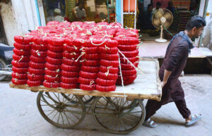 A person pulling handcart loaded with bangles supply to Bangles Market.