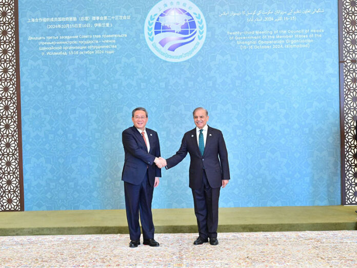 Prime Minister Muhammad Shehbaz Sharif receiving the Chinese Premier H.E. Li Qiang upon the latter's arrival at the venue of the 23rd SCO Council of Heads of Government Meeting