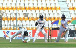 Abdullah Shafique dives in a valiant attempt to catch England's Shoaib Bashir during day four of the Second Test Match at Multan Cricket Stadium.