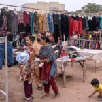 People busy in selecting and purchasing second-hand warm clothes at Kuri Road neighbourhood as winter season approaching
