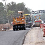 Heavy machinery being used to construction of Park Road during development work in the Federal Capital
