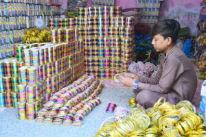 A person pulling handcart loaded with bangles supply to Bangles Market.