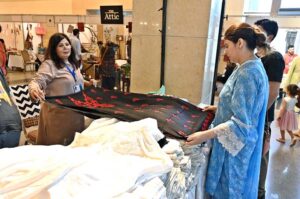Visitors taking keen interest in different handmade items displayed by artisans during two day "Daachi Arts & Craft Exhibition" at Pak China Friendship Centre in the Federal Capital