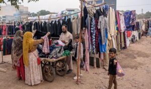 People busy in selecting and purchasing second-hand warm clothes at Kuri Road neighbourhood as winter season approaching
