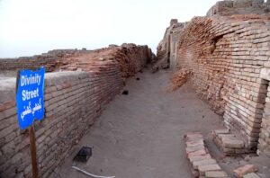 A view of street of world famous archeological site of Moen-Jo-Daro. SD area named after Khan Sahib AD Siddiqui representing the citadel or the upper city. It was excavated during the year 1922-28. It served as both religious and administrative center of Mohenjodaro. A Buddhist Stupa and a monastery of 2nd Century AD constructed on the ruins of the ancient citadel about sixteen hundred years after the destruction of Mohenjodaro. Among the important buildings of the citadel area are the Great Bath, State Granary and series of bath rooms and complete building, all probability a College of Priests.